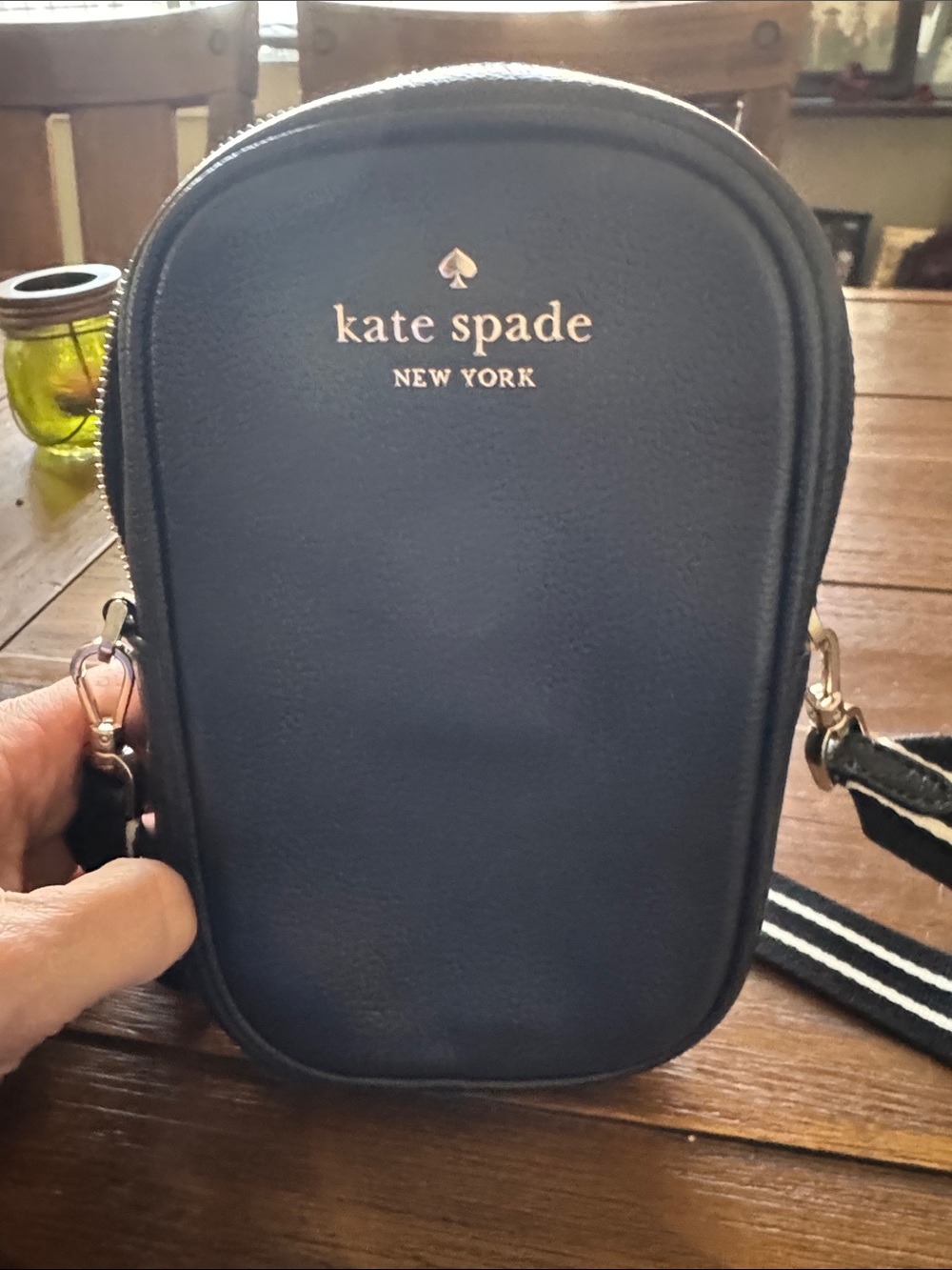 kate spade black crossbody phone pouch with gold logo